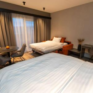 Postel nebo postele na pokoji v ubytování Hotel Halond