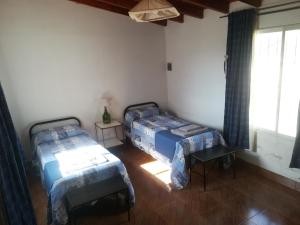 Ένα ή περισσότερα κρεβάτια σε δωμάτιο στο El Pesebre