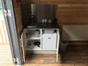 a small kitchen with a counter and a stove at Disney Pod 7 Pet Free in Neath