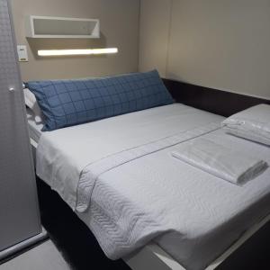 a large bed in a hospital room with at Hotel Aero Sleep Campinas in Campinas