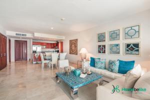 a living room with a couch and a table at Ocean View 1 BR Apartment at Punta Palmera DB7 in Punta Cana