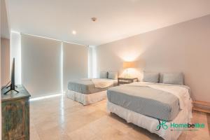 Ένα ή περισσότερα κρεβάτια σε δωμάτιο στο Ocean View 1 BR Apartment at Punta Palmera DB7