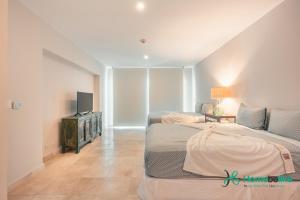 Ένα ή περισσότερα κρεβάτια σε δωμάτιο στο Ocean View 1 BR Apartment at Punta Palmera DB7 +14 φωτογραφίες