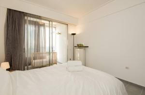 A bed or beds in a room at PanOrama View, Nilie Hospitality MGMT