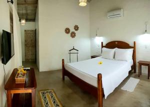 Postel nebo postele na pokoji v ubytování Pousada Villages Boutique Hotel - 150m da Praia da Laje