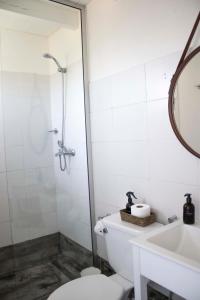 a bathroom with a shower and a toilet and a sink at ALMAR- Punta Rubia, La Pedrera in La Pedrera