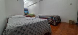 Postel nebo postele na pokoji v ubytování Hostal Miconia + 18 fotografií