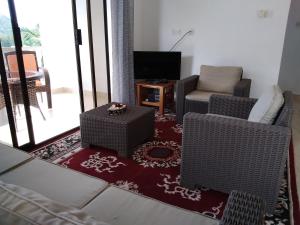 TV o dispositivi per l'intrattenimento presso Belle Rose Vue guest house
