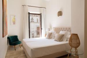 Posteľ alebo postele v izbe v ubytovaní Puerta Catedral Apartments