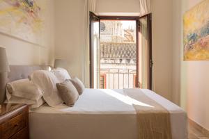 Posteľ alebo postele v izbe v ubytovaní Puerta Catedral Apartments
