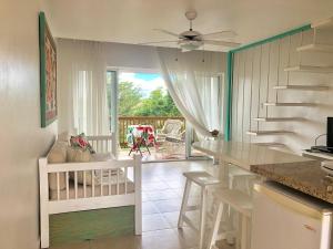 a kitchen with a staircase and a living room at Beach Day @CadaquesCaribe Bayahibe in Bayahibe