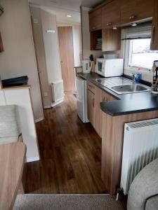 a kitchen with a sink and a counter top at Swift Loire (Field view 78) in Jaywick Sands