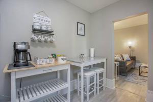 a kitchen with a counter with a coffee maker at Stunning Couples Retreat - Downtown Getaway in Grand Rapids