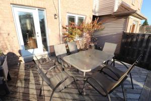 a table and chairs sitting on a patio at Best, Prime location! Next to Vaughan mills! in Vaughan