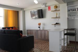 TV a/nebo společenská místnost v ubytování Mercé Hotel