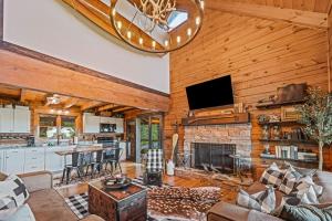 a living room with a couch and a fireplace at The Overlook at Talking Rock Creek Resort in Ranger