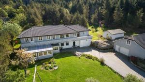 an aerial view of a house with a yard at Flemsøy in Ålesund