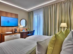 TV a/nebo společenská místnost v ubytování EST Grand Hotel Savoy