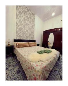 a bedroom with a bed and a mirror at Dream Escape in Santa Cruz de Tenerife