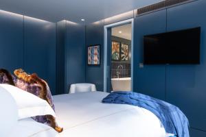 Postel nebo postele na pokoji v ubytování Sun Street Hotel Shoreditch