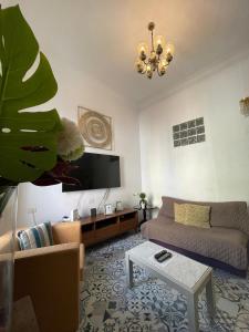 a living room with a couch and a table at Dream Escape in Santa Cruz de Tenerife