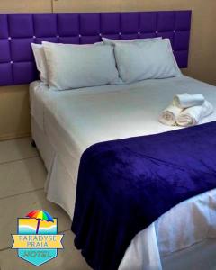 En eller flere senger på et rom på Hotel Paradyse Praia