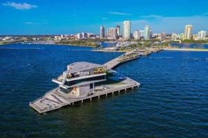 a large boat is docked at a dock in the water at RETRO RETREAT in DTSP - Explore the downtown area in St. Petersburg