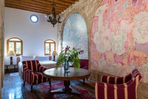 a living room with a table and chairs at Arthaus Beirut in Beirut