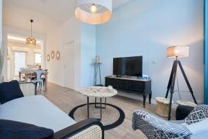 TV a/nebo společenská místnost v ubytování Locations Tourcoing - Le Renaix