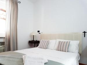 Posteľ alebo postele v izbe v ubytovaní Villa del Sogno