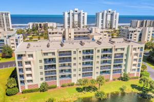 an aerial view of a building in front of the beach at Oceanwalk Suite in New Smyrna Beach