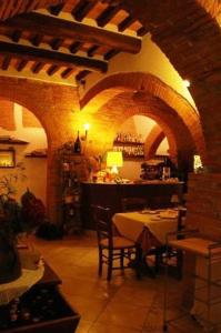 A restaurant or other place to eat at La Locanda Del Castello