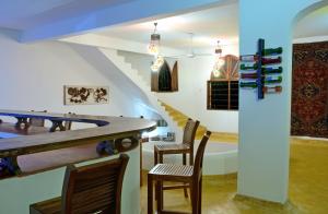 a dining room with a pool table and chairs at Hodi Hodi Zanzibar in Matemwe