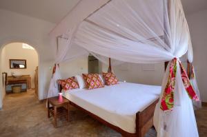 En eller flere senge i et værelse på Hodi Hodi Zanzibar