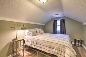 a bedroom with a large bed with a window at Sky Terrace Modern Apartment in Jonesboro! in Jonesboro