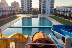 a swimming pool in the middle of a building at Long Beach Rental Apartments in Trikomo