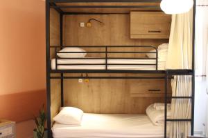 a bunk bed room with four bunk beds at Mantur Metula by Selina in Metulla