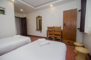 Llit o llits en una habitació de Yalamul Garden