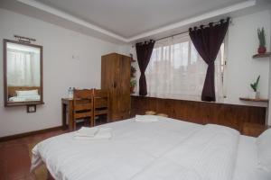 Llit o llits en una habitació de Yalamul Garden