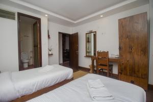 Llit o llits en una habitació de Yalamul Garden
