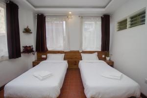 Llit o llits en una habitació de Yalamul Garden