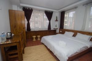 Llit o llits en una habitació de Yalamul Garden