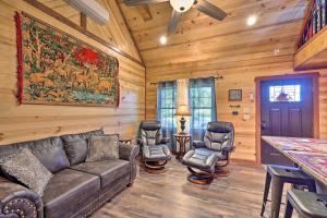 a living room with a couch and chairs in a cabin at Cozy Tree Top Cabin about 3 Mi to Lake Hamilton in Hot Springs