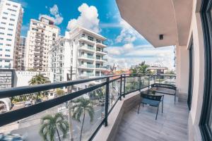 a balcony with a view of a city at Fully Serviced Apartment at Regatta Living - 3B in La Julia