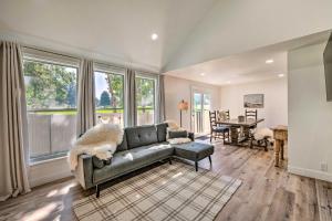 a living room with a couch and a table at Cottonwood Heights Townhome Near Ski Resort! in Cottonwood Heights