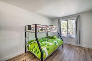 a bedroom with a bunk bed and a window at Cottonwood Heights Townhome Near Ski Resort! in Cottonwood Heights