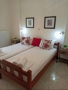 a large bed in a room with at Villa Evdokia in Limenaria