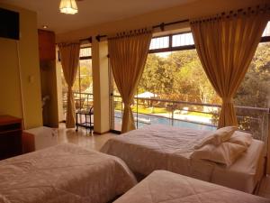 Postel nebo postele na pokoji v ubytování Hotel Rumi Wasi