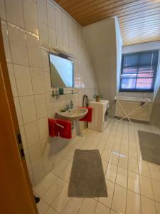 a bathroom with a sink and a toilet at See You Apartment in Germersheim