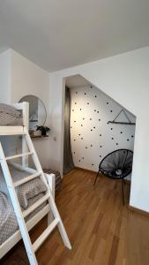 a room with two bunk beds and a wall of balls at Ático de diseño con terraza en el centro de Olot in Olot